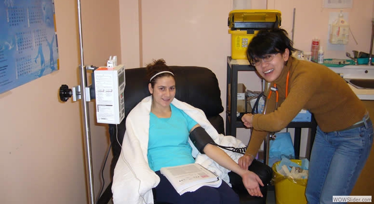 Dr. MyLinh Duong takes a subjects vitals during drug administration